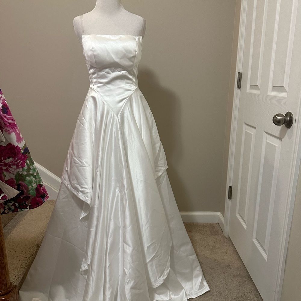 Elegant White Strapless (clear) Wedding Gown v front  flag skirt style
